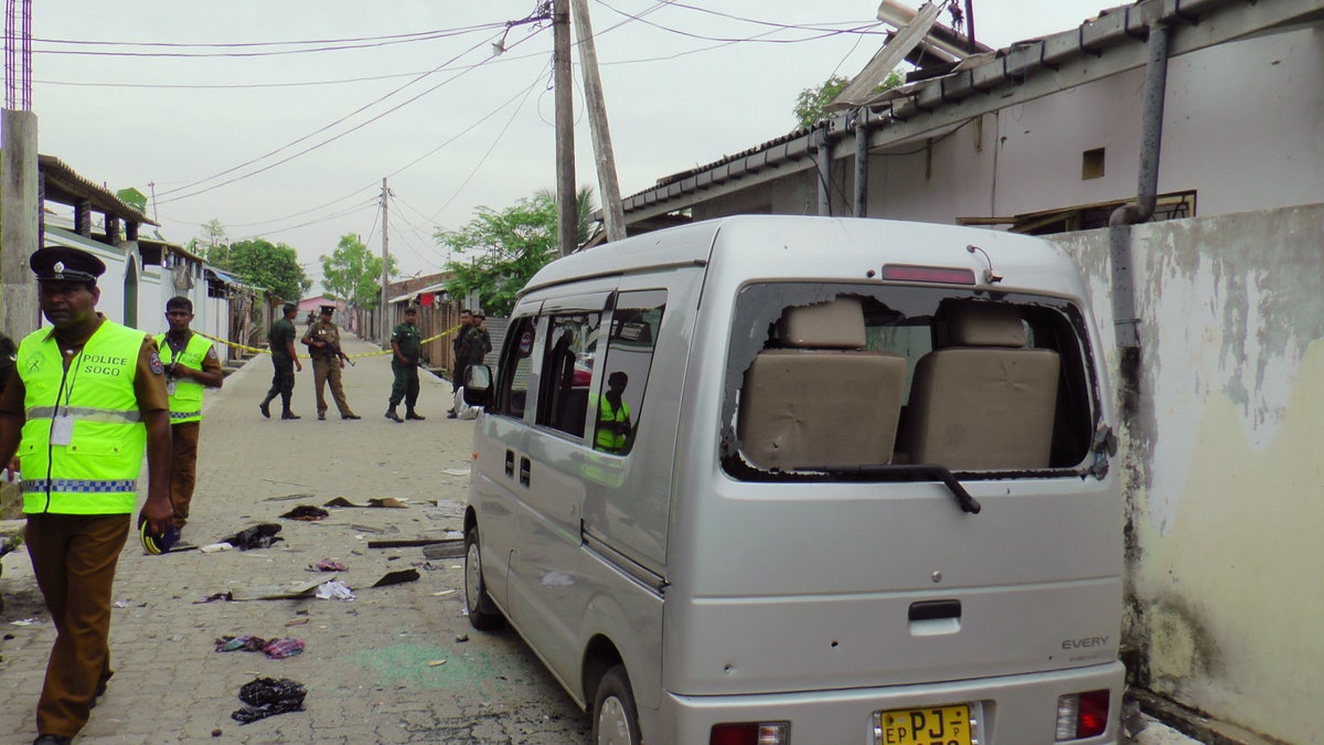 Sri Lankan police and army soldiers secure the site after an explosion and a gunbattle in Kalmunai, eastern Sri Lanka Saturday, April 27, 2019. (Associated Press)