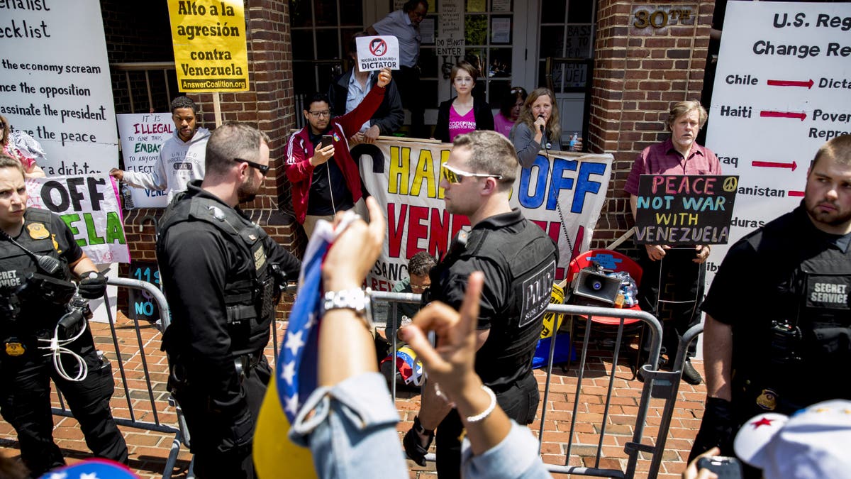 Activists from Code Pink, which protests U.S. support for Guaido, have been living and protesting at the embassy for weeks. On Tuesday, the organization asked supporters to “join us to uphold international law and protect the Venezuelan embassy from a hostile takeover.” (AP Photo/Andrew Harnik)