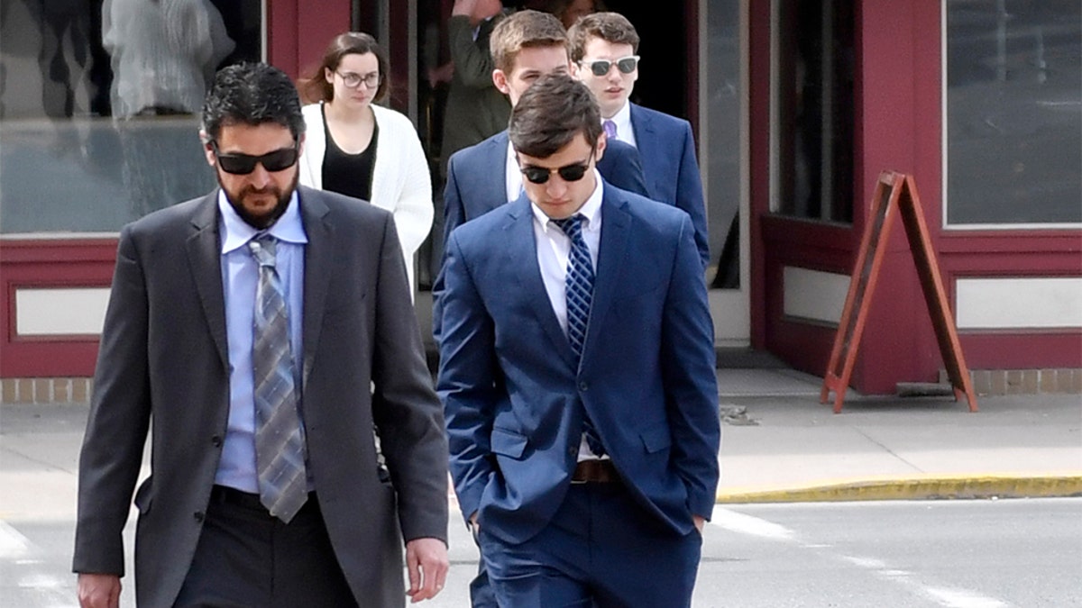 An attorney and several Beta Theta Pi brothers head to the courthouse for sentencing on Tuesday.