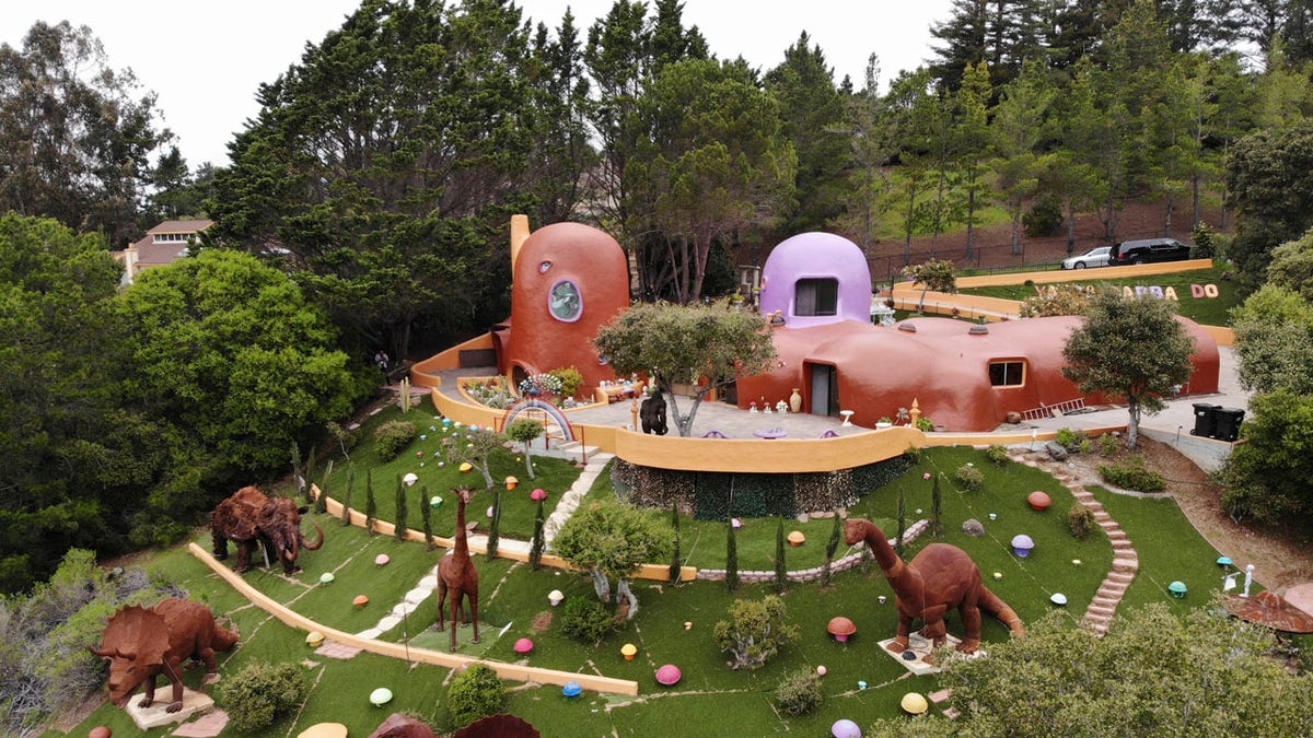 The San Francisco Bay Area suburb of Hillsborough is suing the owner of the so-called Flintstone House, saying that she installed dangerous steps, dinosaurs and other Flintstone-era figurines without necessary permits.