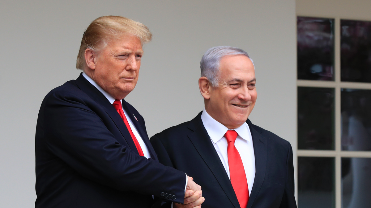 FILE - In this Monday, March 25, 2019 file photo, President Donald Trump welcomes visiting Israeli Prime Minister Benjamin Netanyahu to the White House in Washington. In a tight race for re-election, Israel’s prime minister has gotten a welcome lift from his friend in the White House. In the run-up to the April 9 vote, Netanyahu has hosted Secretary of State Mike Pompeo, visited Trump in the White House and received American recognition of Israeli sovereignty over the Golan Heights, which Israel seized from Syria during the 1967 Mideast war. (AP Photo/Manuel Balce Ceneta, File)