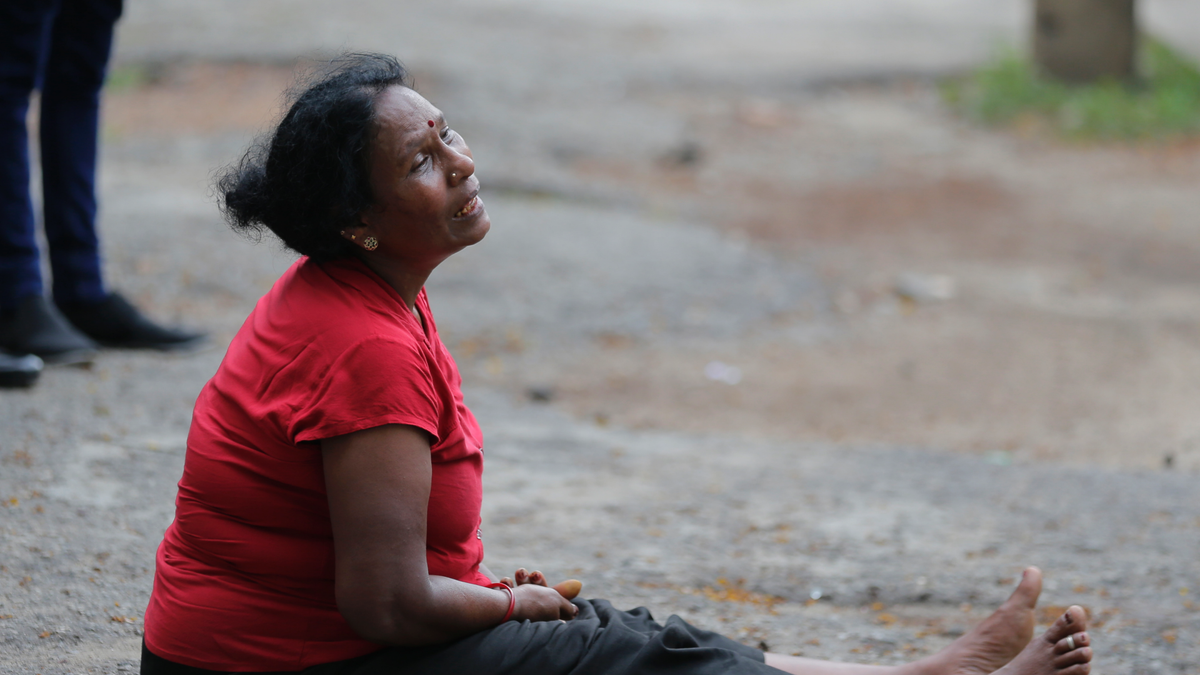 A relative of a blast victim grieves outside a morgue in Colombo, Sri Lanka, Sunday, April 21, 2019. More than hundred were killed and hundreds more hospitalized with injuries from eight blasts that rocked churches and hotels in and just outside of Sri Lanka's capital on Easter Sunday, officials said, the worst violence to hit the South Asian country since its civil war ended a decade ago. (AP Photo/Eranga Jayawardena)