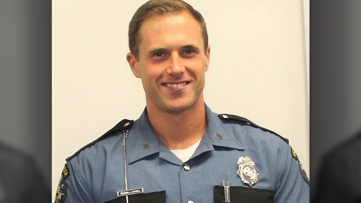 A Maine state police trooper on the scene of a disabled car died on Wednesday after he was hit with a stray truck wheel, officials said.
