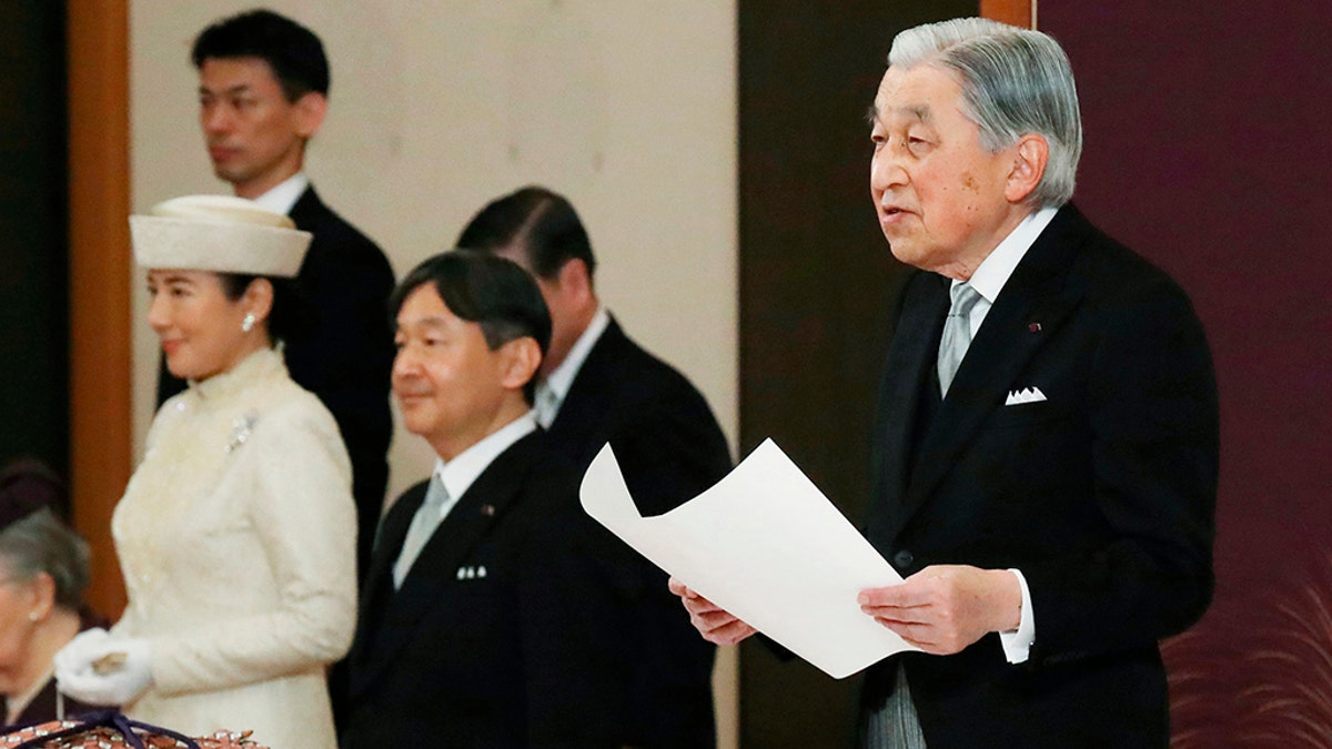 Japan's Emperor Akihito speaks during the ceremony of his abdication in front of other members of the royal families and top government officials at the Imperial Palace in Tokyo, Tuesday. The 85-year-old Akihito ends his three-decade reign on Tuesday as his son Crown Prince Naruhito, second from left, will ascend the Chrysanthemum throne on Wednesday.