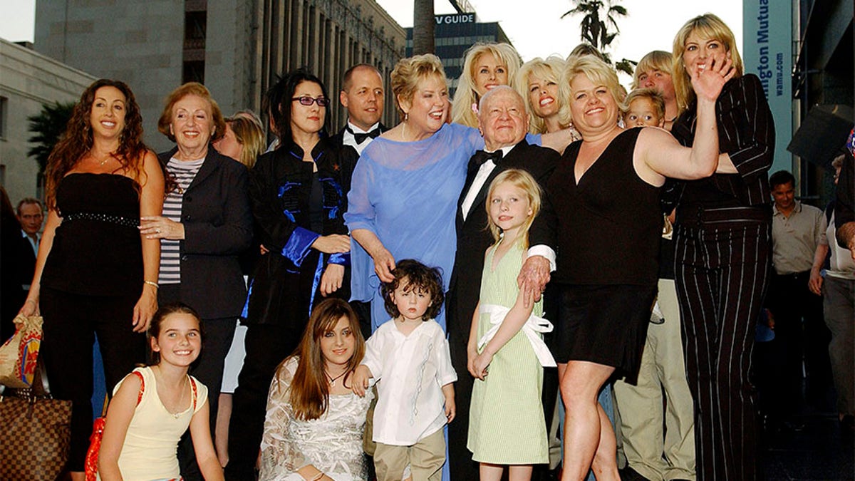 Mickey Rooney and wife Jan (C) pose with family and relatives at the ceremony honoring them with a star on the Hollywood Walk of Fame on April 26, 2004, in Hollywood, California.