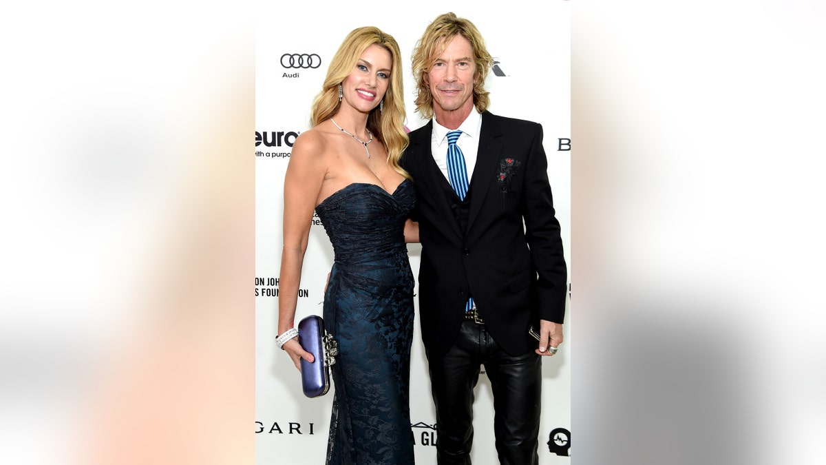 Susan Holmes and musician Duff McKagan attend the 24th Annual Elton John AIDS Foundation's Oscar Viewing Party at The City of West Hollywood Park on Feb. 28, 2016 in West Hollywood, Calif. (Jamie McCarthy/Getty Images for EJAF)
