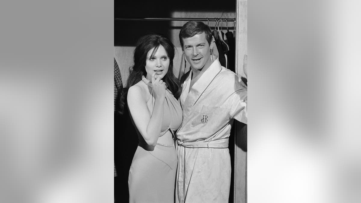 Roger Moore and Madeline Smith. Photo by Terry O'Neill/Iconic Images/Getty Images