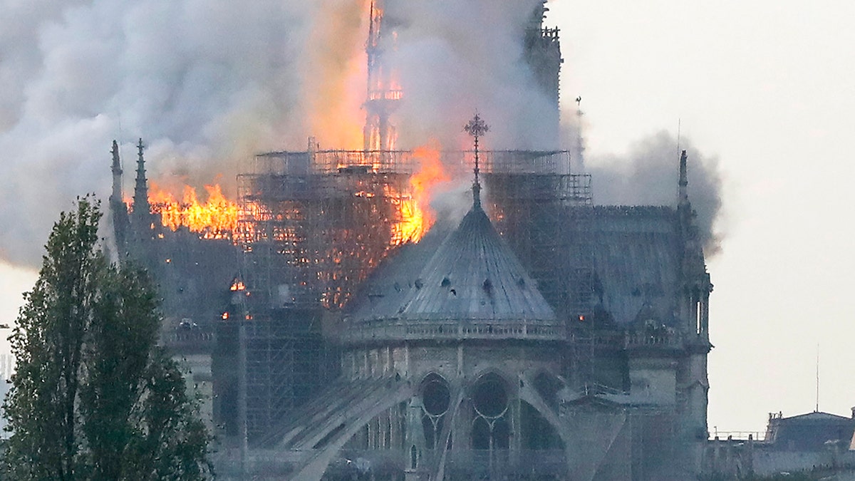 Flames rise during a fire at the landmark Notre-Dame Cathedral in central Paris on April 15, 2019 afternoon.