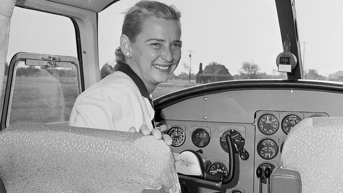 In this Oct. 14, 1960 file photo, Jerrie Cobb sits in the cockpit of a twin engine Aero Commander airplane, as advertising and sales promotion manager of the plane's manufacturing company in Oklahoma City. (AP Photo)