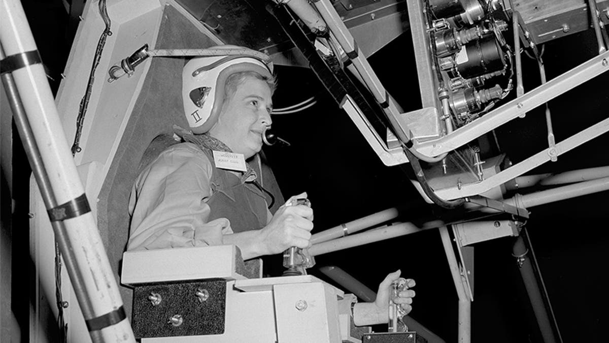 In this 1960 photo made available by NASA, Jerrie Cobb prepares to operate the Multi-Axis Space Test Inertia Facility (MASTIF) at the Lewis Research Center in Ohio. (NASA via AP)