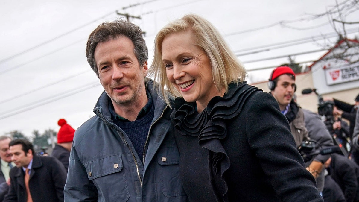 Sen. Kirsten Gillibrand and her husband Jonathan Gillibrand walk together after a media availability announcing she will run for president in 2020 outside the Country View Diner, January 16, 2019 in Troy, New York. (Photo by Drew Angerer/Getty Images)