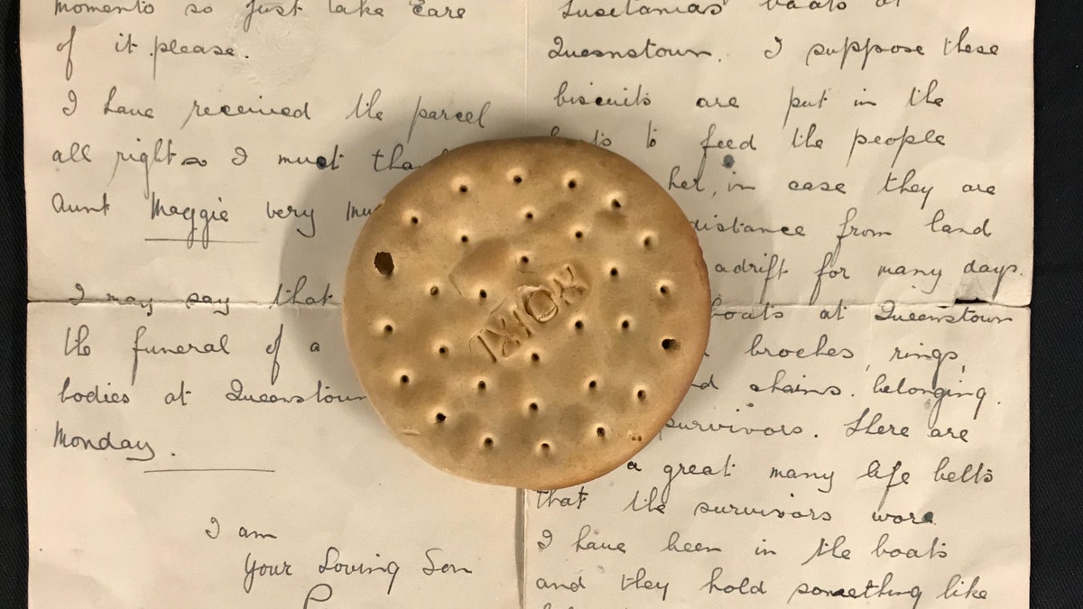 The hardtack ship's biscuit and the letter describing its discovery. (Henry Aldridge and Son)