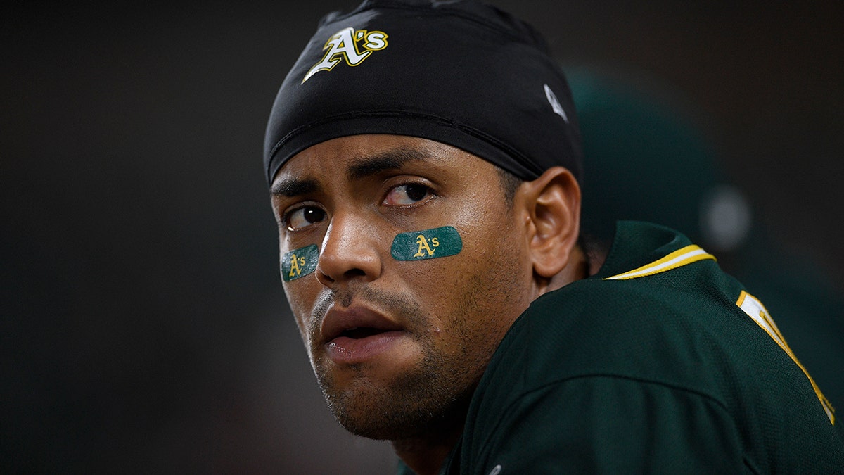 Oakland Athletics' Khris Davis watches from the dugout during the eighth inning of a baseball game against the Baltimore Orioles, Monday, April 8, 2019, in Baltimore.
