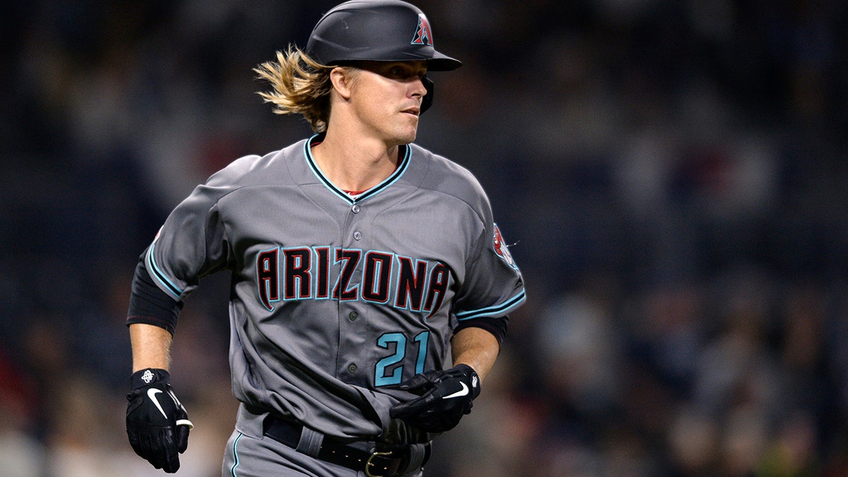Arizona Diamondbacks' Zack Greinke runs the bases after hitting a home run during the sixth inning of a baseball game against the San Diego Padres, Tuesday, April 2, 2019, in San Diego.