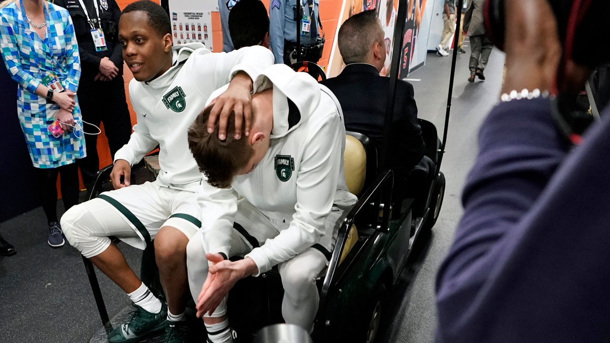 Michigan State's Cassius Winston, left, and Matt McQuaid react after the team's 61-51 loss to Texas Tech. (AP Photo/David J. Phillip)