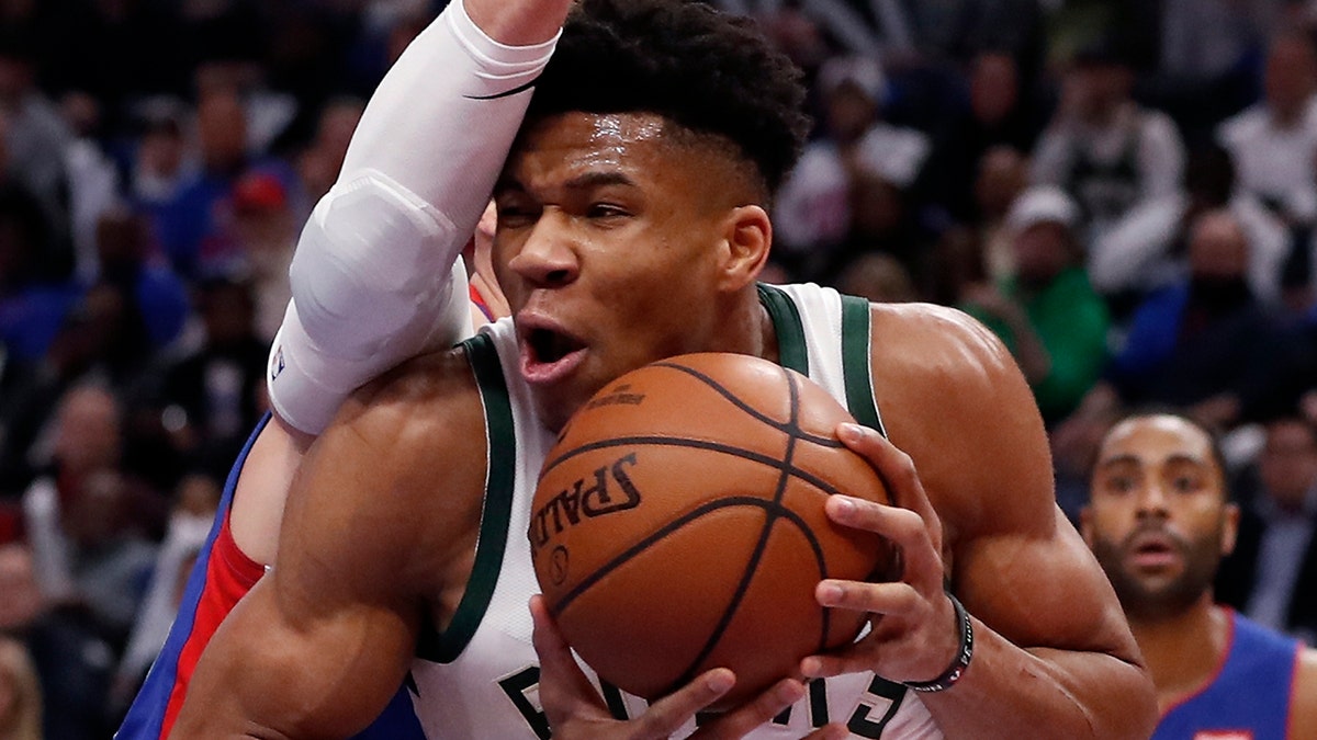 Milwaukee Bucks forward Giannis Antetokounmpo (34) is defended by Detroit Pistons forward Blake Griffin during the first half of Game 3 of a first-round NBA basketball playoff series, Saturday, April 20, 2019, in Detroit. (AP Photo/Carlos Osorio)