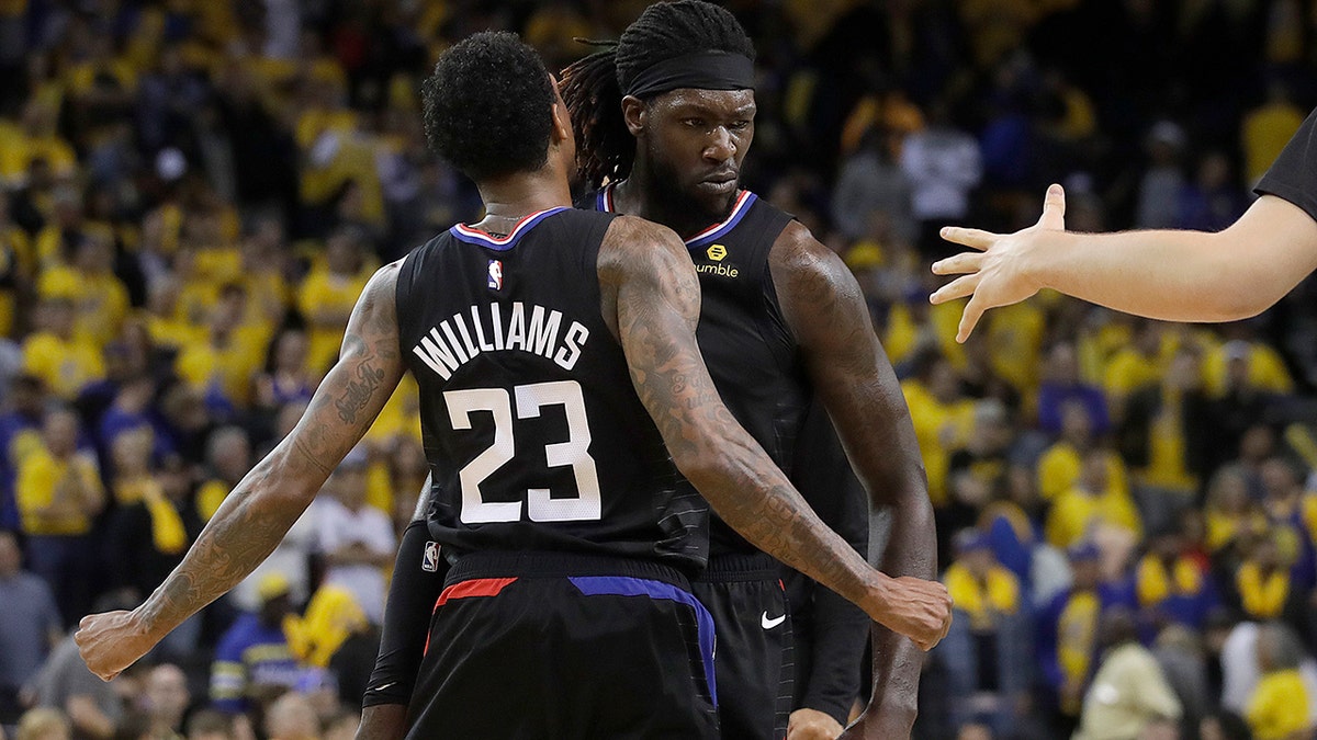 Los Angeles Clippers guard Lou Williams (23) celebrates with forward Montrezl Harrell during the second half of Game 2 of a first-round NBA basketball playoff series against the Golden State Warriors in Oakland, Calif., Monday, April 15, 2019. (AP Photo/Jeff Chiu)