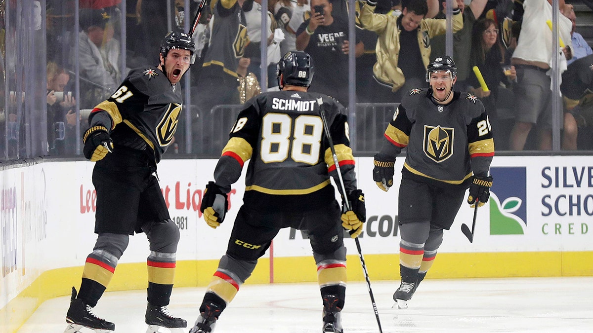 Vegas Golden Knights right wing Mark Stone, left, celebrates after scoring against the San Jose Sharks during the first period of Game 3 of an NHL first-round hockey playoff series game, Sunday, April 14, 2019, in Las Vegas. (AP Photo/Isaac Brekken)