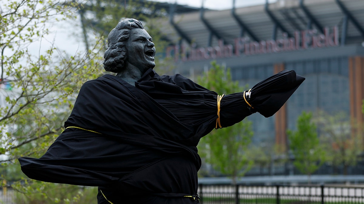 A partially covered statue of singer Kate Smith is seen near the Wells Fargo Center, Friday, April 19, 2019, in Philadelphia. (AP Photo/Matt Slocum)