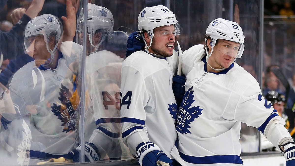 Toronto Maple Leafs' Auston Matthews (34) celebrates his goal with teammate Nikita Zaitsev (22) during the third period in Game 5 of an NHL hockey first-round playoff series against the Boston Bruins in Boston, Friday, April 19, 2019. (AP Photo/Michael Dwyer)