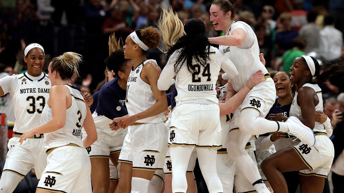 The Notre Dame team celebrates at the end of the team's 81-76 win over Connecticut during a Final Four semifinal of the NCAA women’s college basketball tournament Friday, April 5, 2019, in Tampa, Fla.(Associated Press)