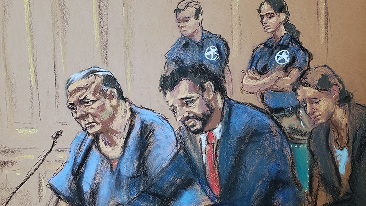 Cesar Sayoc, left, sits with his lawyers in Manhattan federal court Monday.