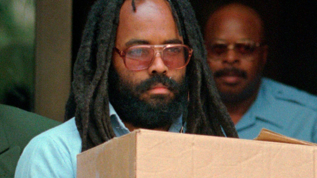 FILE - In this July 12, 1995 file photo, Mumia Abu-Jamal leaves Philadelphia's City Hall after a hearing. (AP Photo/Chris Gardner, File)