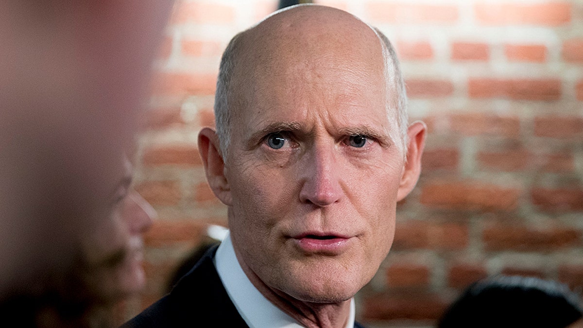 Sen. Rick Scott, R-Fla., speaks to reporters outside his office on Capitol Hill in Washington, Wednesday, Jan. 23, 2019. Scott took questions on Venezuela and the government shutdown. (AP Photo/Andrew Harnik)