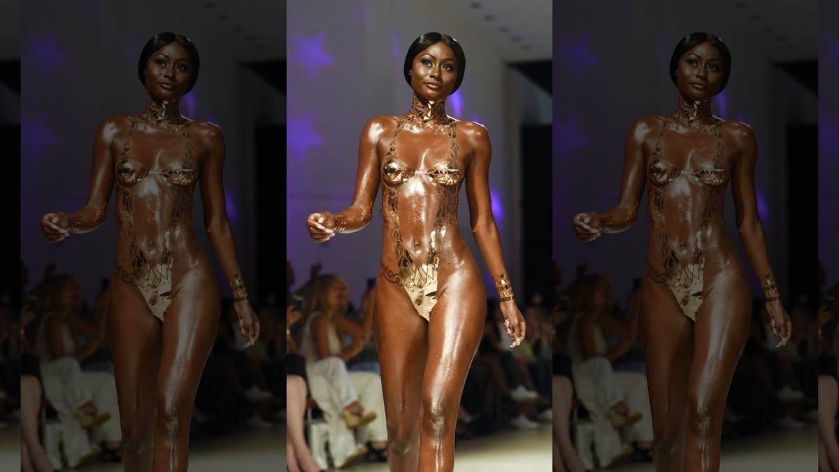 A model walks the runway for Black Tape Project at Miami Swim Week in 2018.
