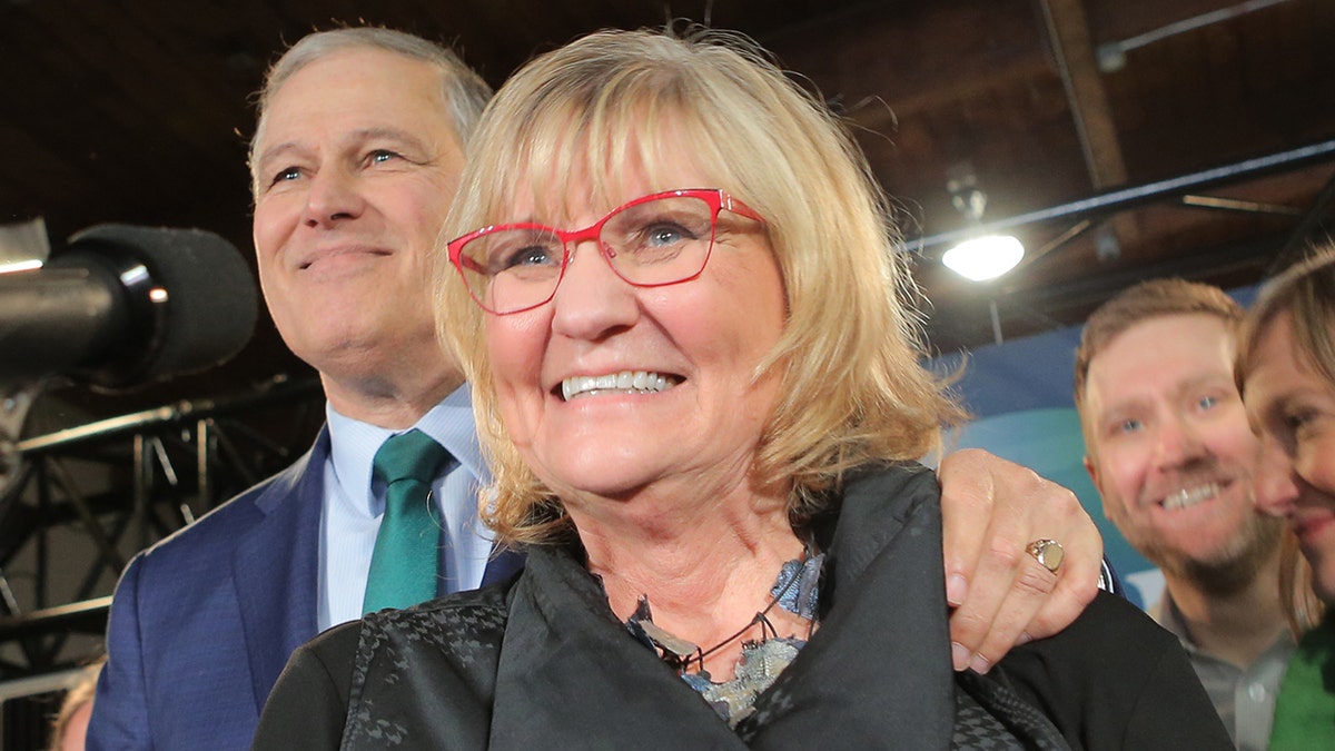 Washington Gov. Jay Inslee (left) and his wife Trudi Inslee as he announces his run for the 2020 Presidency at A & R Solar on March 1, 2019 in Seattle, Washington. (Photo by Karen Ducey/Getty Images)