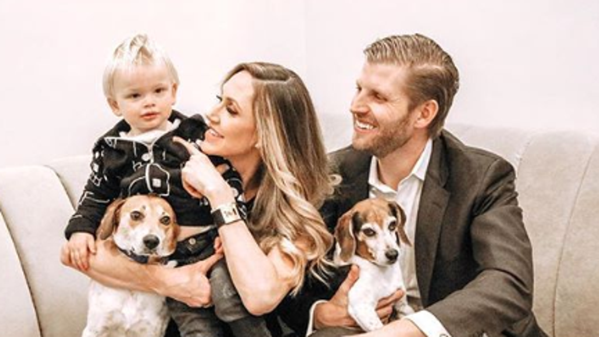 Lara and Eric Trump with their 1-year-old son Luke and their two dogs Charlie and Ben.