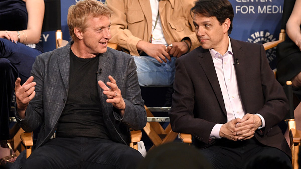 William Zabka, left, and Ralph Macchio speak onstage at the "Cobra Kai" premiere at The Paley Center for Media on April 22 in Beverly Hills, California.