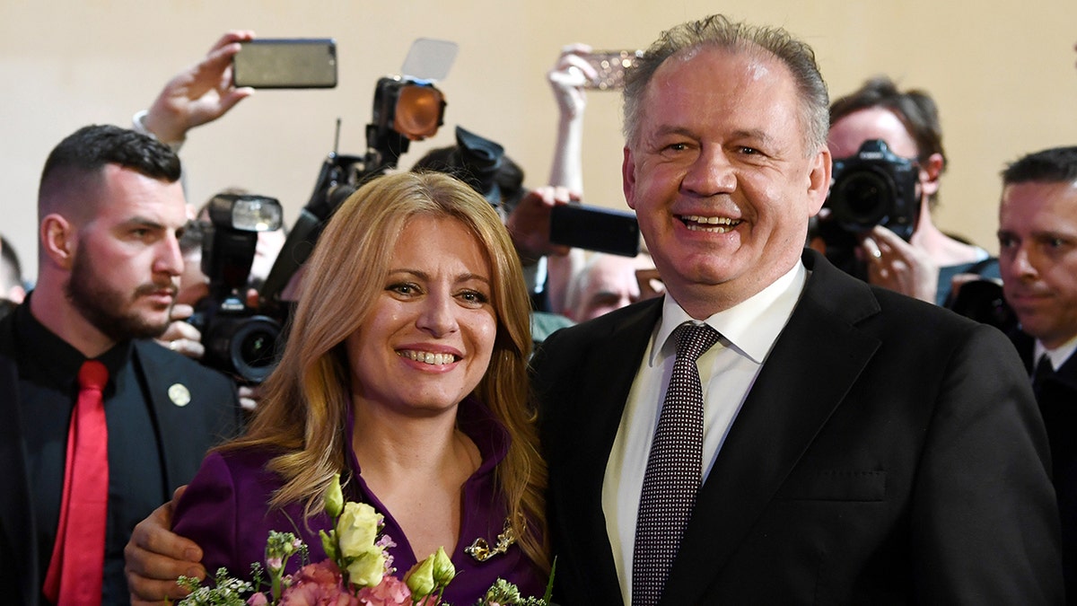 Slovakia's current president Andrej Kiska poses with president-elect Zuzana Caputova at her party's headquarters in Bratislava, Slovakia, March 30, 2019.