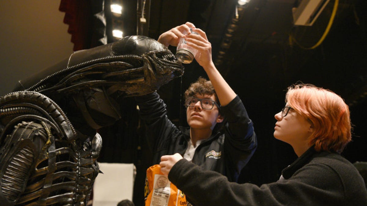 North Bergen High School's Xavier Perez, 16, the Alien, is covered in slime by his handlers Eddie Mantilla, 15, and Cassandra Klima, 16, as they work on the play "Alien," an adaptation of the Ridley Scott movie, in North Bergen, N.J.