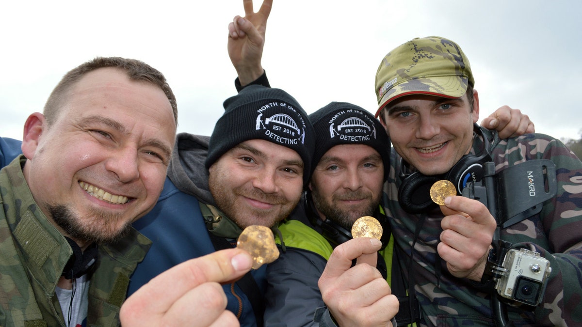 Dariusz Fijalkowski , Mateusz Nowak, Andrew Winter, Tobiasz Nowak. Four amateur metal detectorists have uncovered a hoard of 14th-century coins in a field in Hambleden, Buckinghamshire- worth an estimated £150,000. (Credit: SWNS)