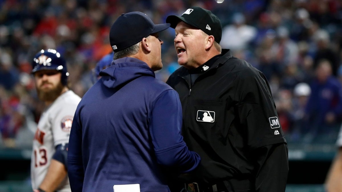 Houston Astros manager AJ Hinch argues with umpire Ron Kulpa, right, during the second inning of the team's baseball game against the Texas Rangers in Arlington, Texas, Wednesday, April 3, 2019.
