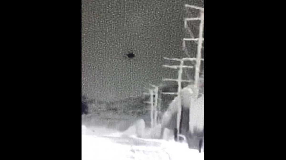This image released by the Border Patrol shows a drone hovering over U.S. territory during an attempt to help migrants illegally enter America.