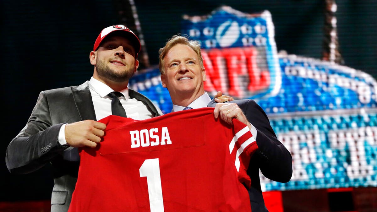 Ohio State defensive end Nick Bosa poses with NFL Commissioner Roger Goodell after the San Francisco 49ers selected Bosa in the first round at the NFL football draft, Thursday, April 25, 2019, in Nashville, Tenn.