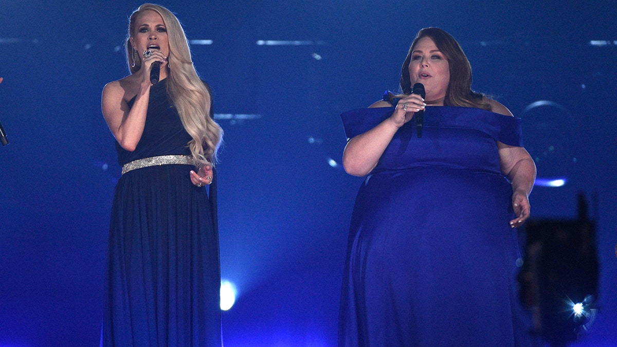 Carrie Underwood, left, and Chrissy Metz perform "I'm Standing with You" at the 54th annual Academy of Country Music Awards at the MGM Grand Garden Arena on Sunday, April 7, 2019, in Las Vegas. (Photo by Chris Pizzello/Invision/AP)