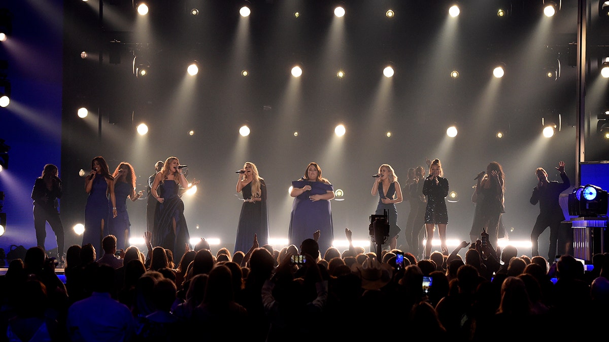 Mickey Guyton, from left, Lauren Alaina, Carrie Underwood, Chrissy Metz, and Maddie Marlow and Tae Dye, of Maddie & Tae, perform "I'm Standing with You" at the 54th annual Academy of Country Music Awards at the MGM Grand Garden Arena on Sunday, April 7, 2019, in Las Vegas. (Photo by Chris Pizzello/Invision/AP)