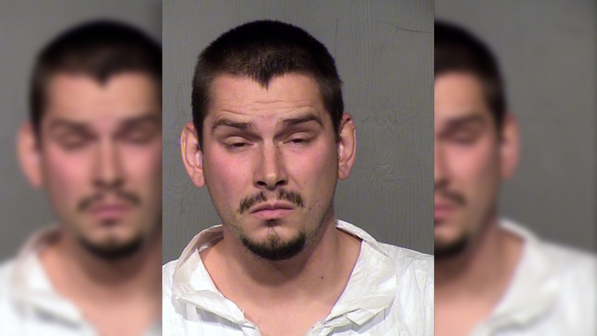 Mugshot for Eldon McInville, 26, charged by police in Glendale, Ariz., with assault and child abuse in the accidental shooting of his daughter, 6, as he was teaching her gun safety. 