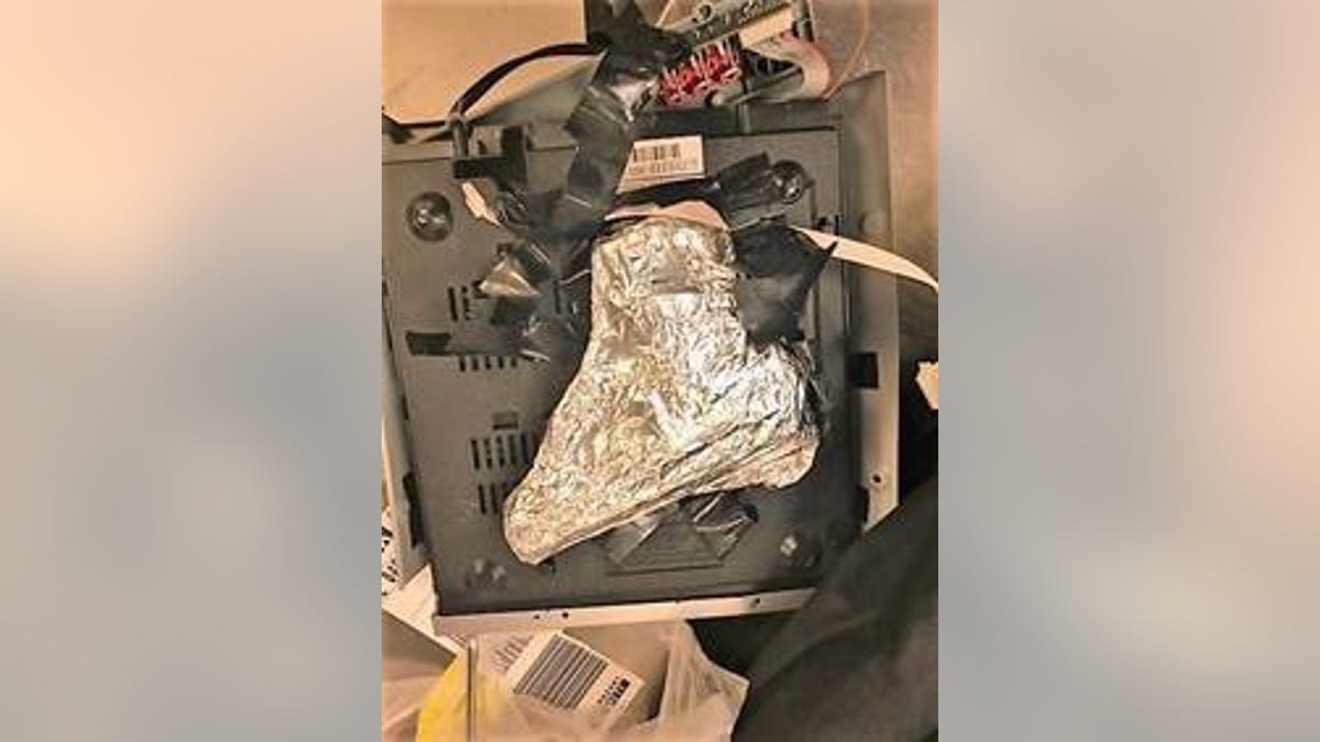 The 9mm was found wrapped in tinfoil and hidden inside a DVD player.