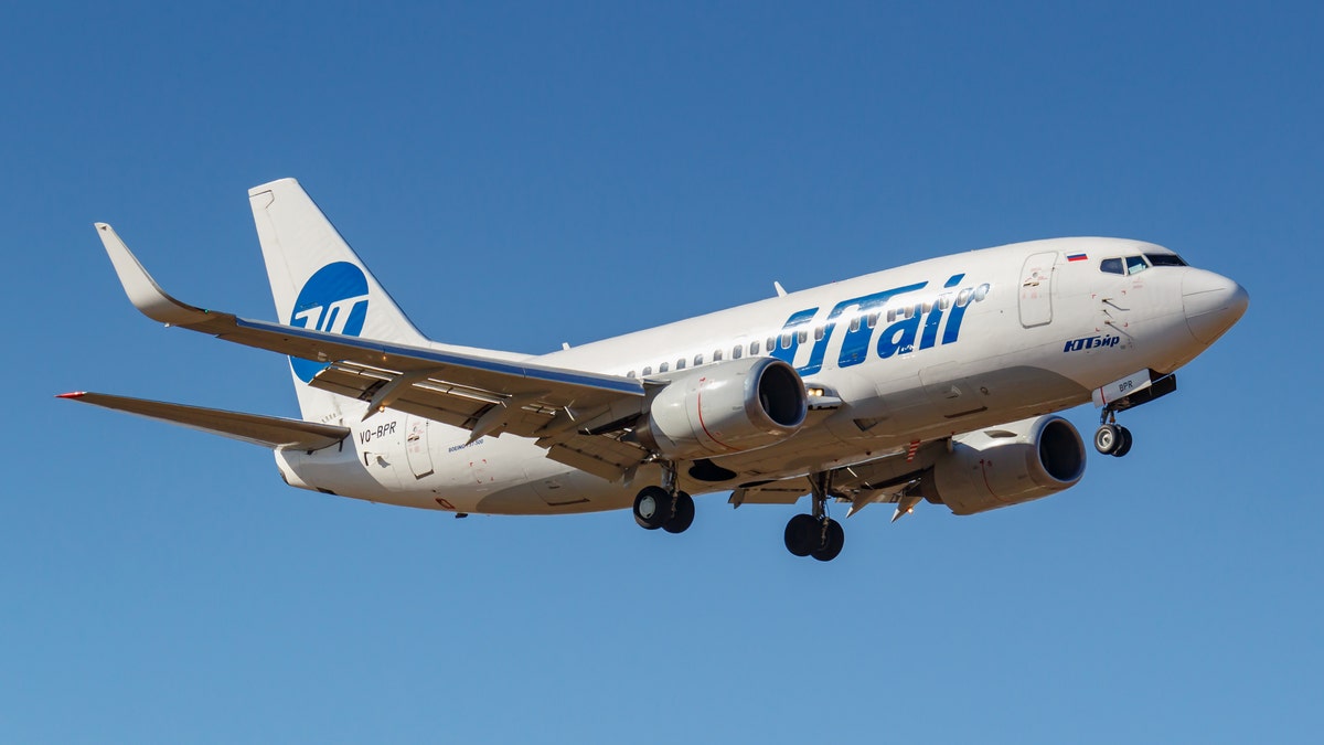 Moscow, Russia - April 03, 2019: Aircraft Boeing 737-524(WL) VQ-BPR of UTair Aviation going to landing against blue sky at Vnukovo international airport in Moscow at sunny day