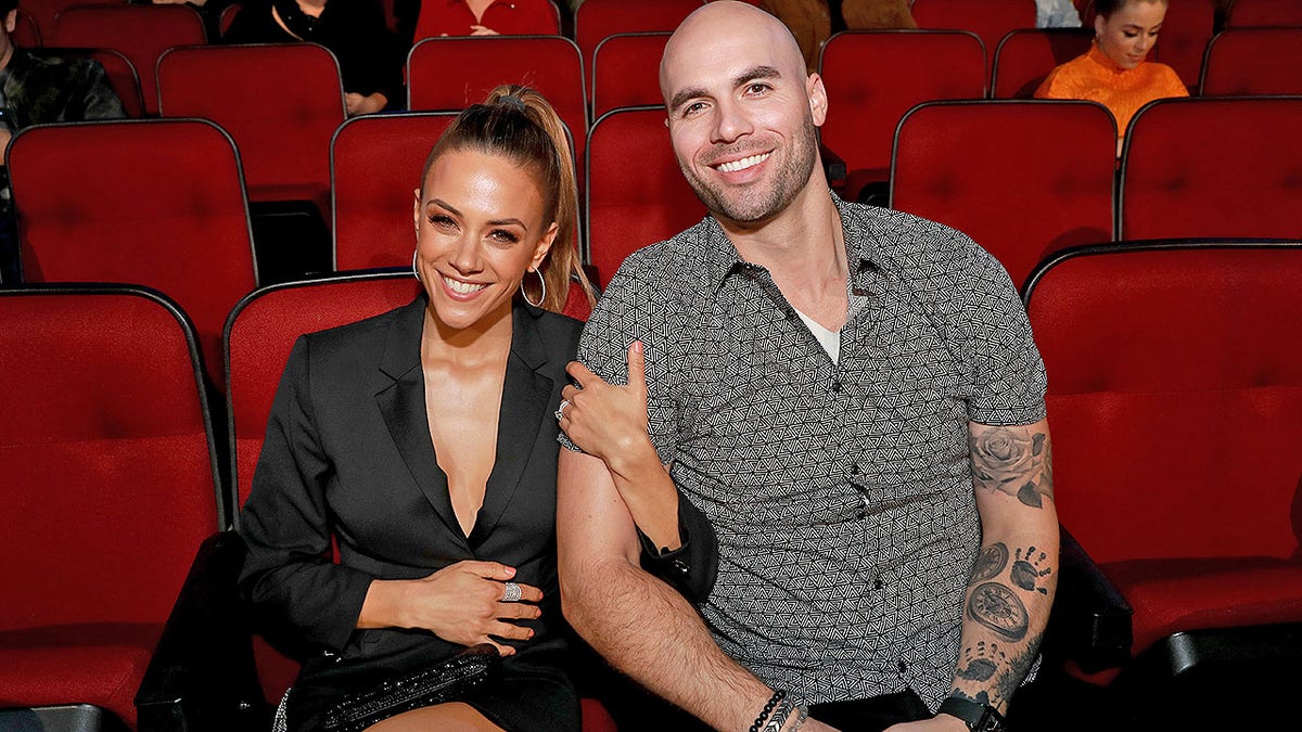 LOS ANGELES, CALIFORNIA - MARCH 14: (EDITORIAL USE ONLY. NO COMMERCIAL USE)  (L-R) Jana Kramer and Mike Caussin attend the 2019 iHeartRadio Music Awards which broadcasted live on FOX at the Microsoft Theater on March 14, 2019 in Los Angeles, California. (Photo by Rich Fury/Getty Images for iHeartMedia)