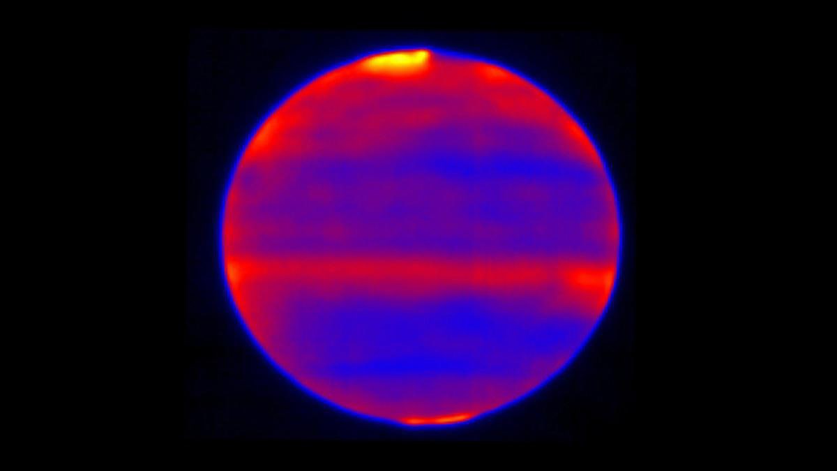 Scientists used red, blue and yellow to infuse this infrared image of Jupiter's atmosphere (red and yellow indicate the hotter regions), which was recorded by the Cooled Mid-Infrared Camera and Spectrograph (COMICS) at the Subaru Telescope on the summit of Mauna Kea, Hawaii on Jan. 12, 2017. (Credit: NAOJ and NASA/JPL-Caltech)