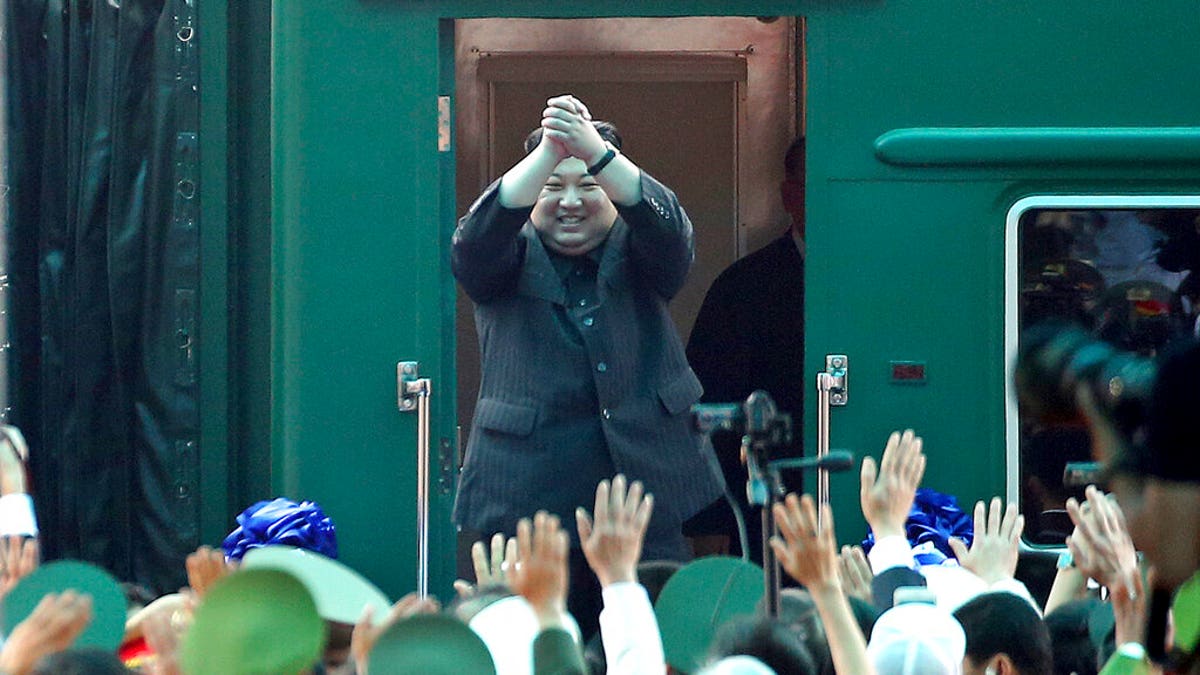 In this March 2, 2019, file photo, North Korean leader Kim Jong Un waves from his train as he arrives at the railway station in Dong Dang, Vietnam.