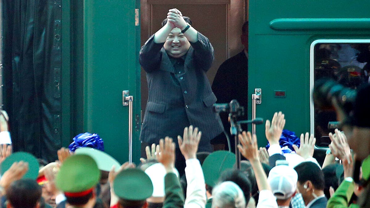 In this March 2, 2019, file photo, North Korean leader Kim Jong Un waves from his train as he arrives at the railway station in Dong Dang, Vietnam.