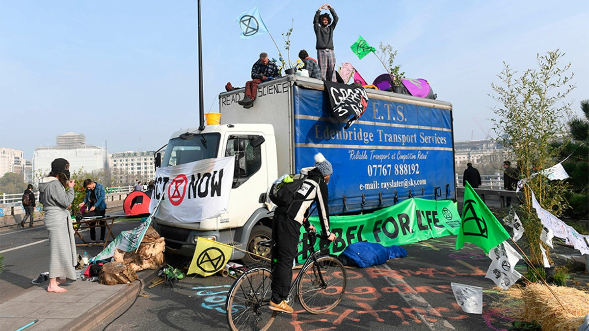 Extinction Rebellion climate change demonstrators block Waterloo Bridge, a main thoroughfare for commuters in London, on Thursday.
