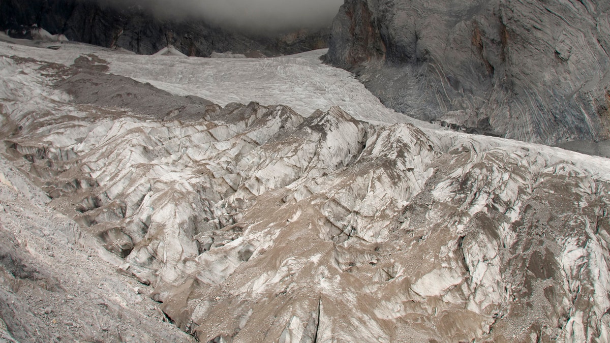 This Sept. 22, 2018 file photo shows the Baishui Glacier No.1 on the Jade Dragon Snow Mountain in the southern province of Yunnan in China. Scientists say it is one of the fastest melting glaciers in the world due to climate change and its relative proximity to the Equator. It has lost 60 percent of its mass and shrunk 250 meters since 1982. (AP Photo/Sam McNeil)