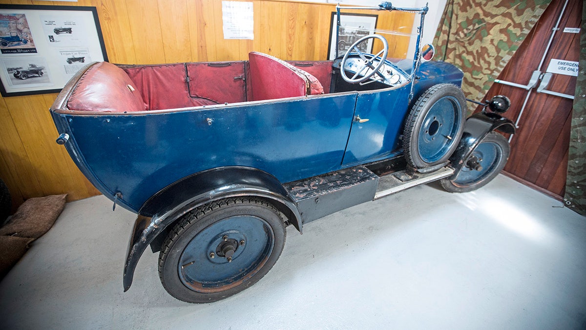 The 1926 Trojan Tourer was successfully hidden inside a vinery shed during WWII after the Germans banned all cars for private use. Cars seized on the island were requisitioned for as little as £1 and moved to France.